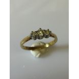 An 18ct gold ring with 3 good diamonds