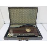 An unamed zither in hard case