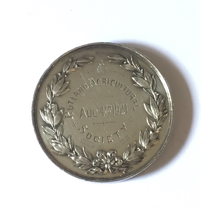 A hallmarked silver medal for Rutland Agricultural Society dated August 4th 1921 along with a SCM - Image 3 of 5