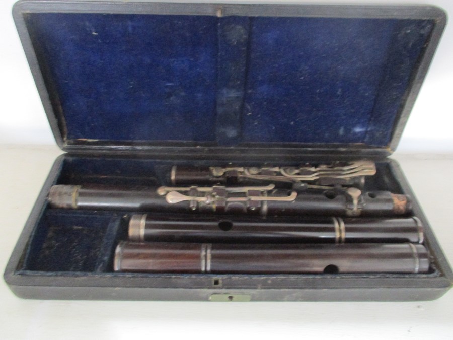 A 19th century cased Rudall & Rose flute with SCM mounts- some slight splitting to mouthpieces,