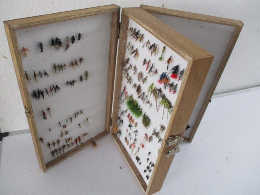 A collection of fishing flies in double sided Bob Church case