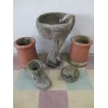 A pair of chimney pots, garden urn decorated with a squirrel , and two other garden ornaments