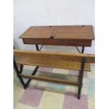 A vintage wood and cast iron double school desk