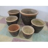 A set of six matching garden pots