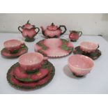 A collection of Zsolnay pink and floral decorated tea ware including tea pot, sugar bowls, cream jug