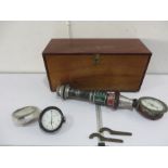 A vintage fire hose nozzle along with fireman's tool chest, pressure gauges including Dennis and