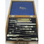 An oak cased Stanley drawing set along with an SCM S.Mordan & Co. pen etc.