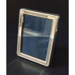 A hallmarked silver photo frame