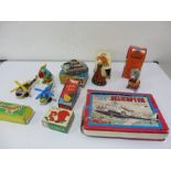 A collection of various tin plates toys, wind up toys etc