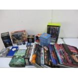 A collection of Doctor Who toys, books, video sets etc