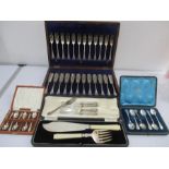 A canteen of fish knives and forks, various silver plated cutlery along with a silver pickle fork