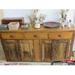 An antique pine dresser base with three drawers A/F