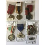 A collection of German 1st and 2nd World War medals along with a Hitler Youth badge.