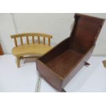 A vintage oak dolls rocker crib and a dolls wooden bench