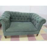 A small two seater Chesterfield settee