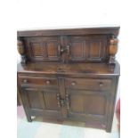 A dark wood Ercol court cupboard