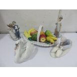 Three Lladro figures including a Swan, a boy and girl and lady along with a Lladro style figure