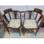 A pair of Edwardian inlaid corner chairs