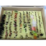 A box of fishing flies