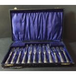 A cased set of silver handled fruit knives and forks