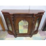 A mahogany and walnut veneered credenza with mirrored doors