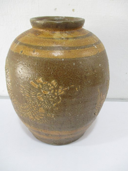 A Chinese stoneware vase depicting a dragon