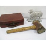 A cast iron doorstop, vintage mallet and a small leather case