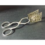 A pair of continental silver cake tongs