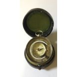 A leather cased Schlesicky- Strohlen, Frankfurt pocket barometer with thermometer and compass to