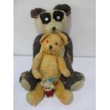 A vintage straw filled panda ( A/F) along with a plush teddy bear and a small rabbit