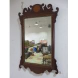 A regency style inlaid mirror