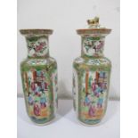 A pair of Famille Rose vases, one with lid, the other A/F, height 28.75 cm including lid