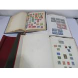 An album of British stamps along with two Worldwide stamps and two empty albums