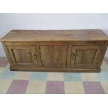 An antique elm low dresser base/ cupboard