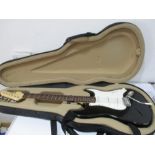 An Encore electric guitar in carry case