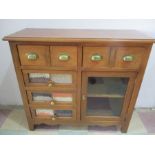 A French chest of drawers with single cupboard, the front of three drawer fronts with lentils and