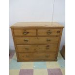 A pine chest of five drawers