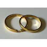 Two 22ct gold wedding bands, one A/F. Total weight 5.3g