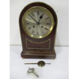 A mahogany bracket clock with brass detailing- pendulum and key etc. in office
