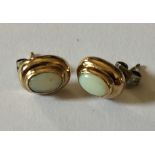 A pair 9ct gold opal earrings.