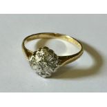 an 18ct gold ring with diamond cluster