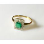 A good emerald and diamond cluster ring set in 18ct gold and platinum. The centre stone approx 6mm x