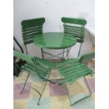 A vintage folding bistro table and four chairs
