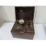 A Waton & Sons Electro-medical treatment unit in wooden case with tools/accessories