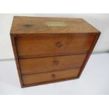 A set of three oak drawers with brass campaign handle to top
