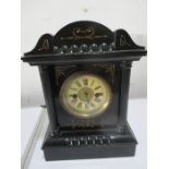 A wooden mantle clock with paper lable to inside "H.A.C 1 day strike, made in Wurttemburg"