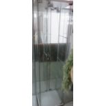 A lockable glass display cabinet with three shelves