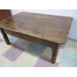 An antique elm coffee table with single drawer