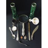 A collection of silver and SCM items including a magnifying glass, strainer, medallions etc.