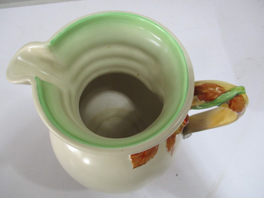 A Clarice Cliff jug with relief moulded floral handle 22.5cm height - Image 3 of 3